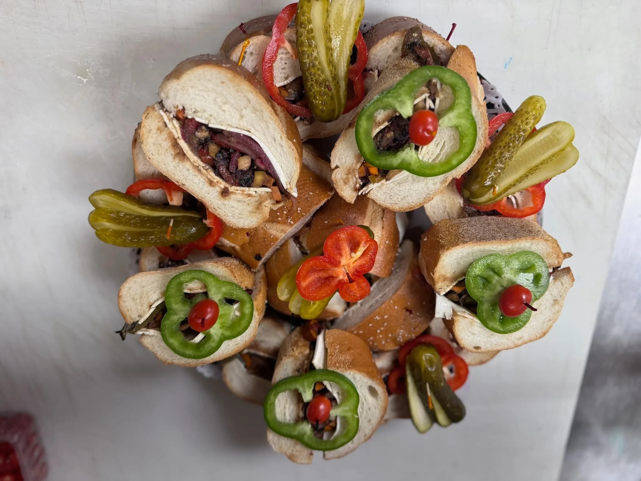An assortment of Party Heros plated up — pick your size, pick your filling, we slice and serve