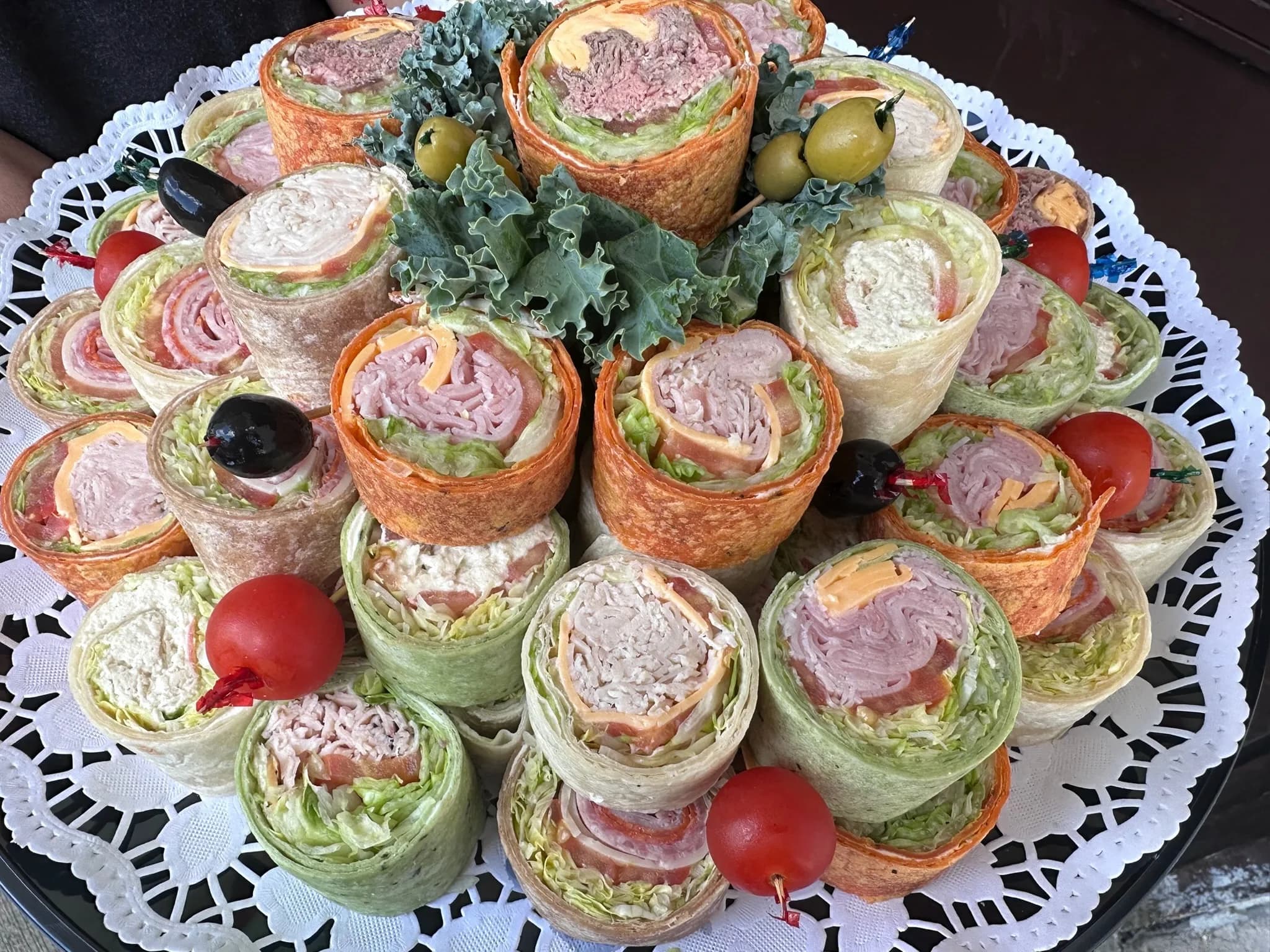 Wrap Platter close-up — multi-color tortillas, each cut to show the filling