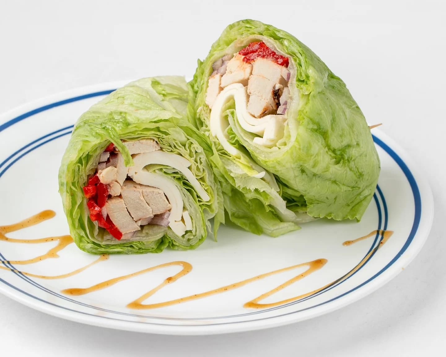 Turkey Lettuce Wrap — sliced turkey breast, Swiss cheese, and ripe tomato