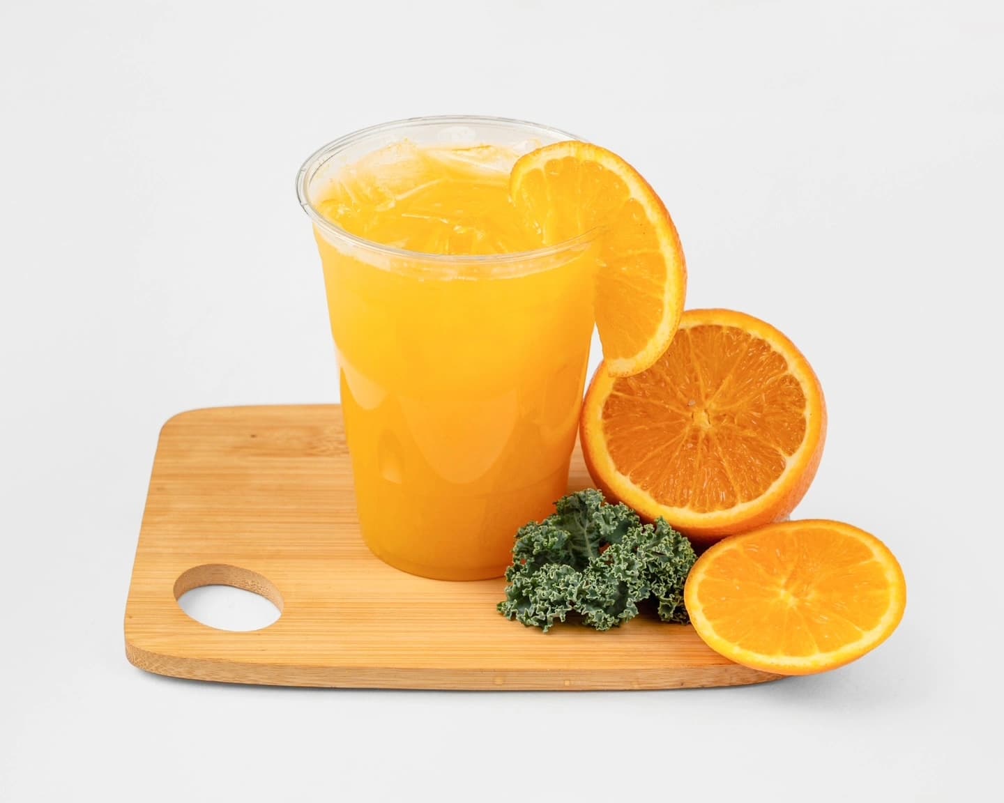 Fresh-squeezed Orange Juice, golden and pulpy, in a cup ready to grab