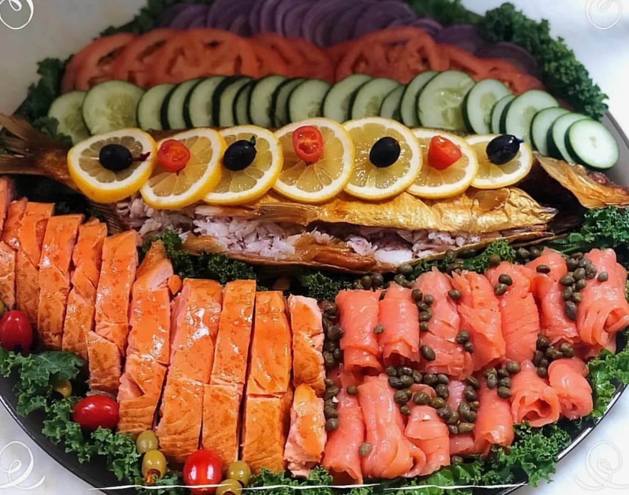 The Master Smoked Fish Platter — hand-sliced Nova, sable, and baked salmon arranged around a stuffed whitefish